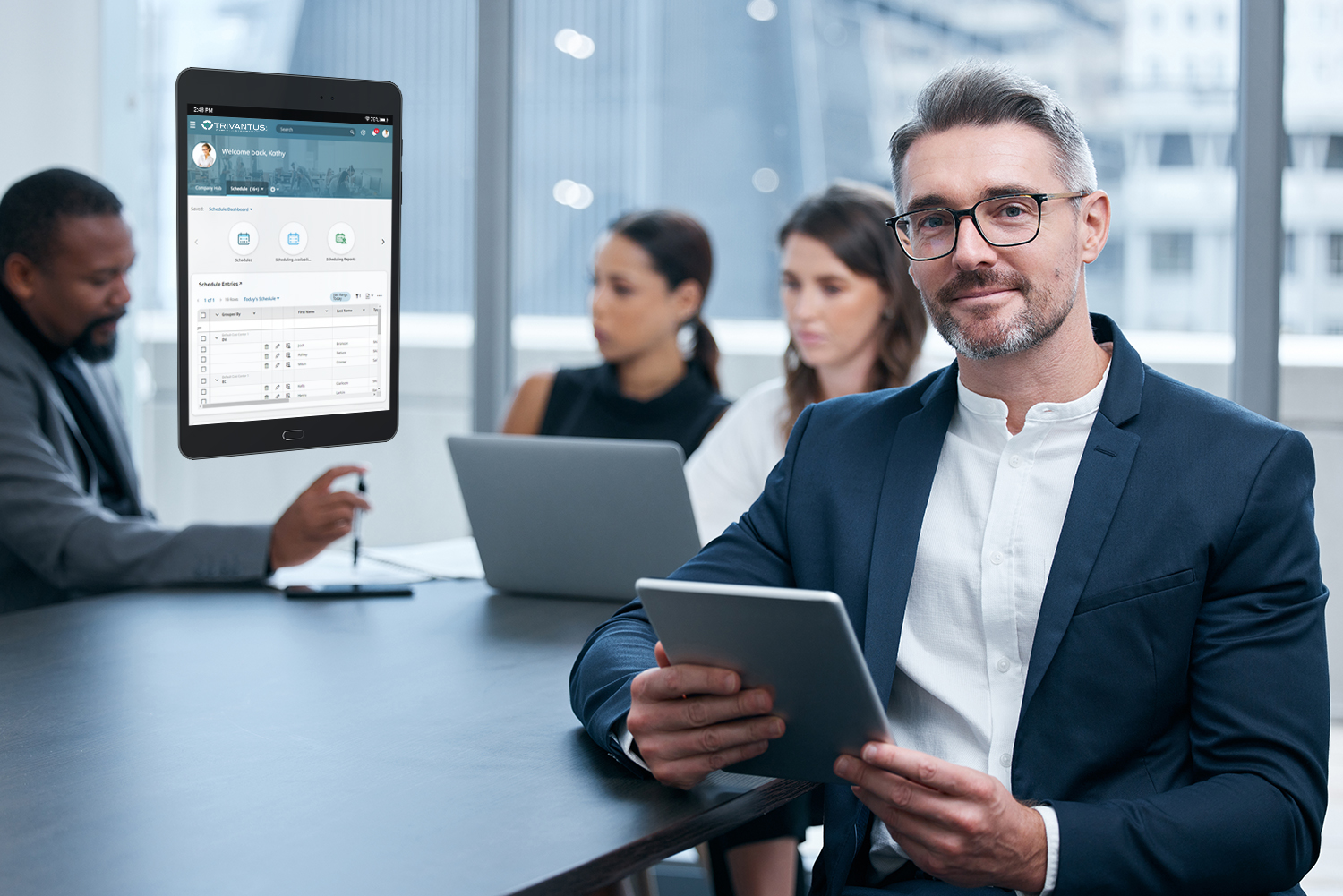 Manager using an employee Scheduling software on a tablet